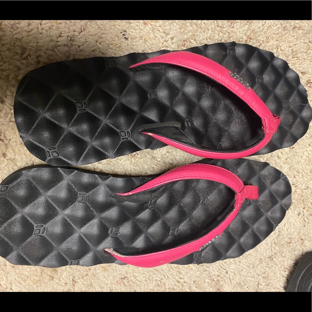Pink flip flops by Reef